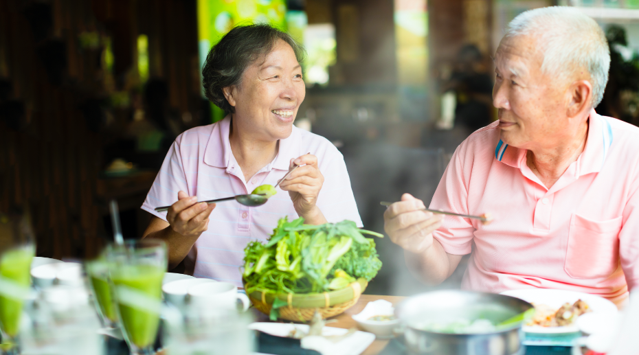 image of older adult asian couple enjoying meal