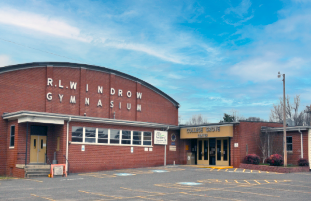 Red brick facade of the College Grove Community Center gymnasium.