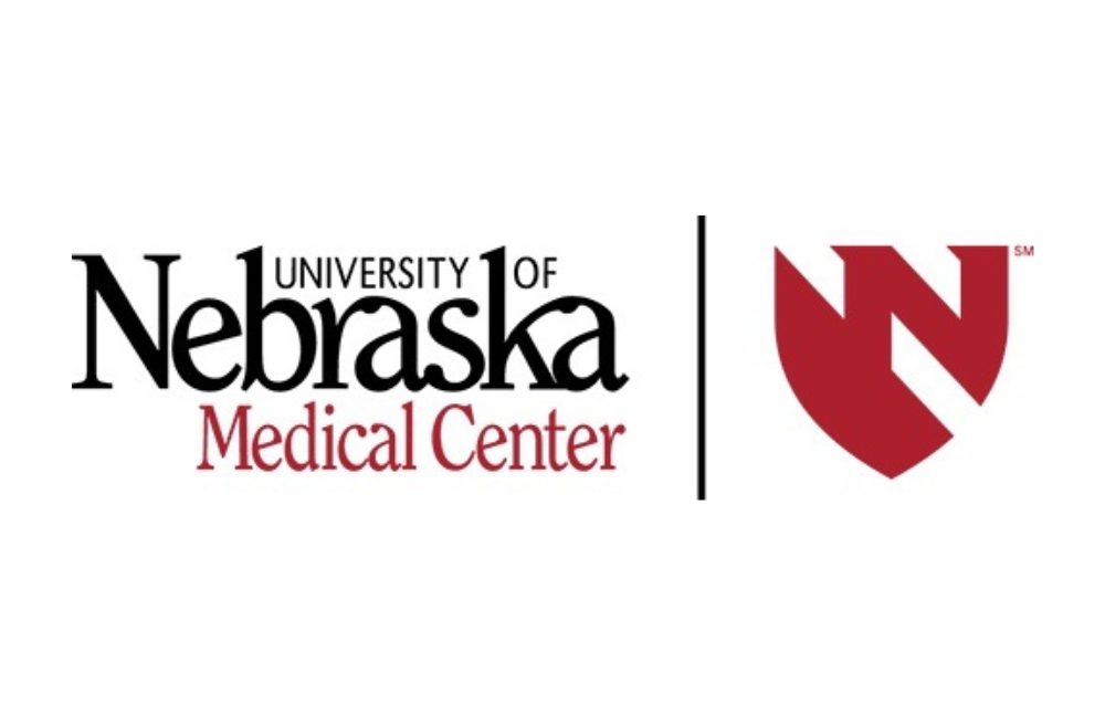White background with 'University of Nebraska' in black text, 'Medical Center' in red text below and an illustration of a shield to the right.